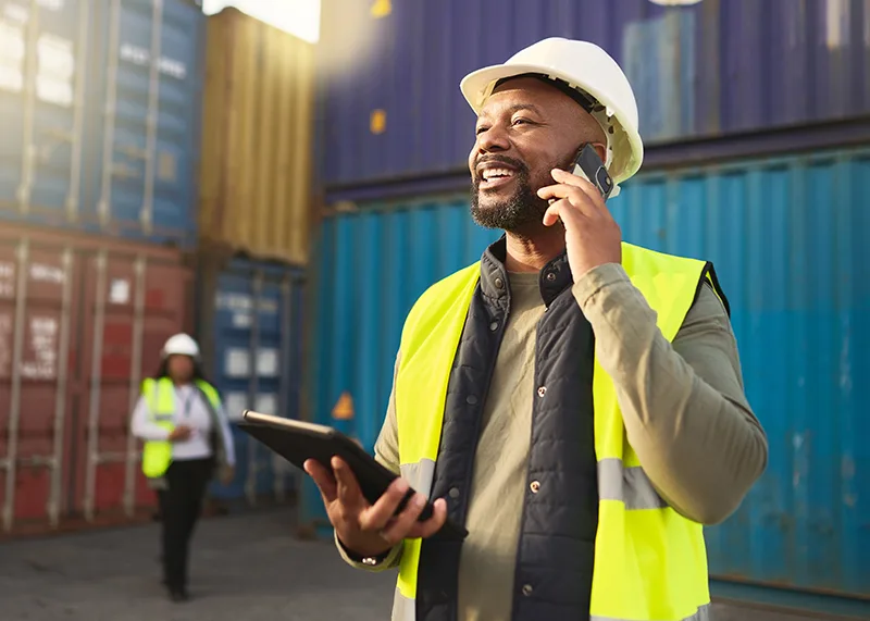 A port management auditor in white helmet.